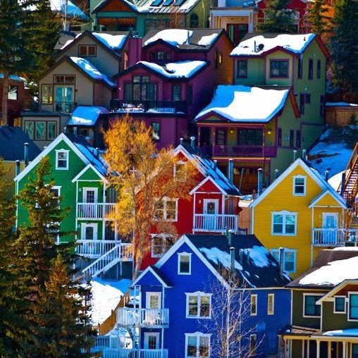 a house with a bunch of colorful houses with XE Park City's luxury transportation.
